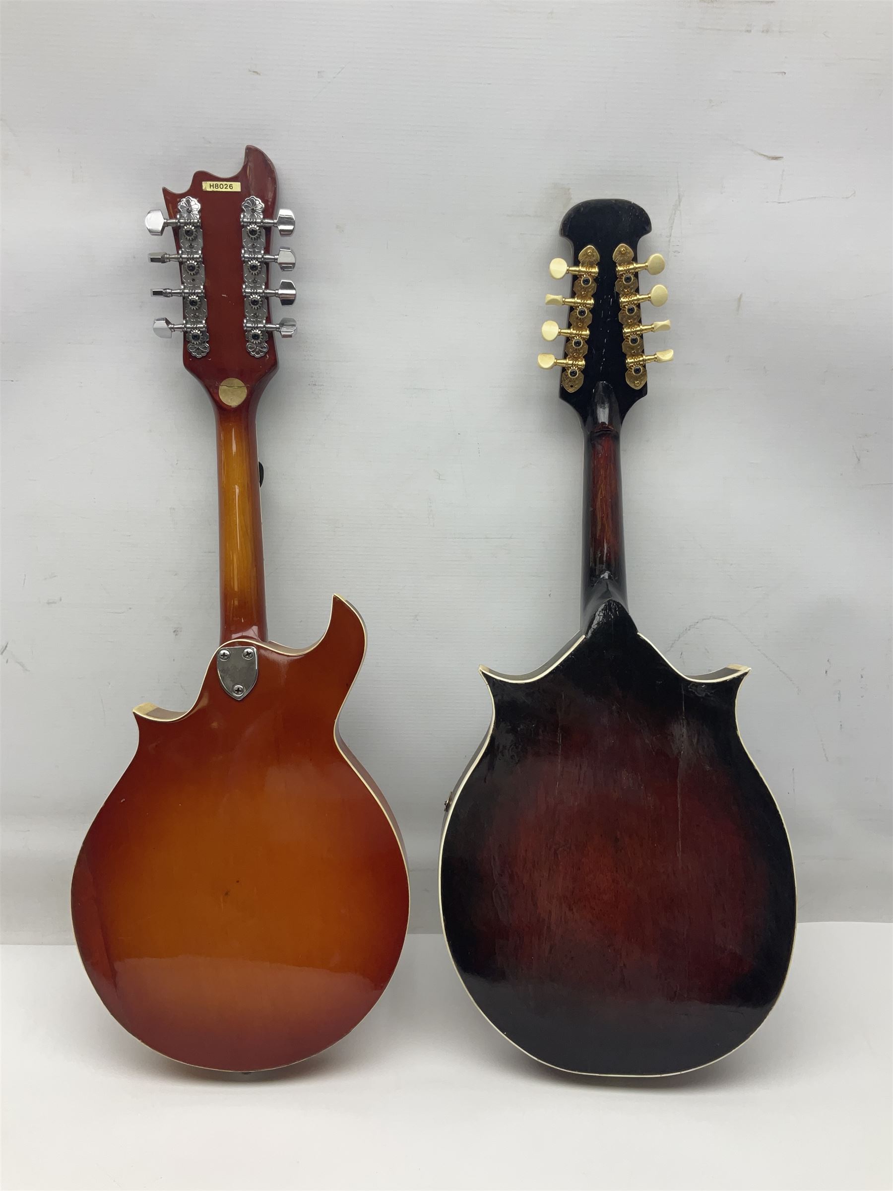 Eastern eight-string mandolin with sunburst finish and mother-of-pearl inlay L68.5cm; and another Harmony mandolin with cracked headstock (2)