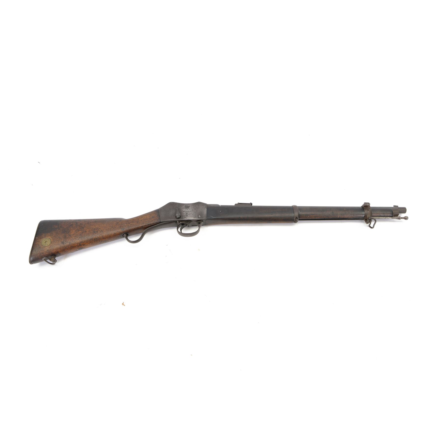 Martini-Henry MKII/2 Carbine, the 52cm round barrel with various inspectors marks,   fitted with ladder sight, with various inspector's marks, the action marked Enfield, the walnut full stock with two steel barrel bands, the butt inset with brass roundel stamped' 12 1893 V 1 GR. A 6', and with Sold Out of Service arrows to the butt, action and barrel, steel cleaning rod beneath, overall 96cm
Sold as an exempt item under Section 58 (2) of the 1968 Firearms Act, to be held as a curiosity or ornament


