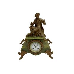 An early 20th century French striking mantle clock c1910, in a green variegated onyx case on cast metal rococo feet and surmounted by a cast metal figure of an 18th century gallant, white enamel dial with Arabic numerals and minute track, eight-day movement with countwheel striking sounding the hours and half hours on a bell. With pendulum. 