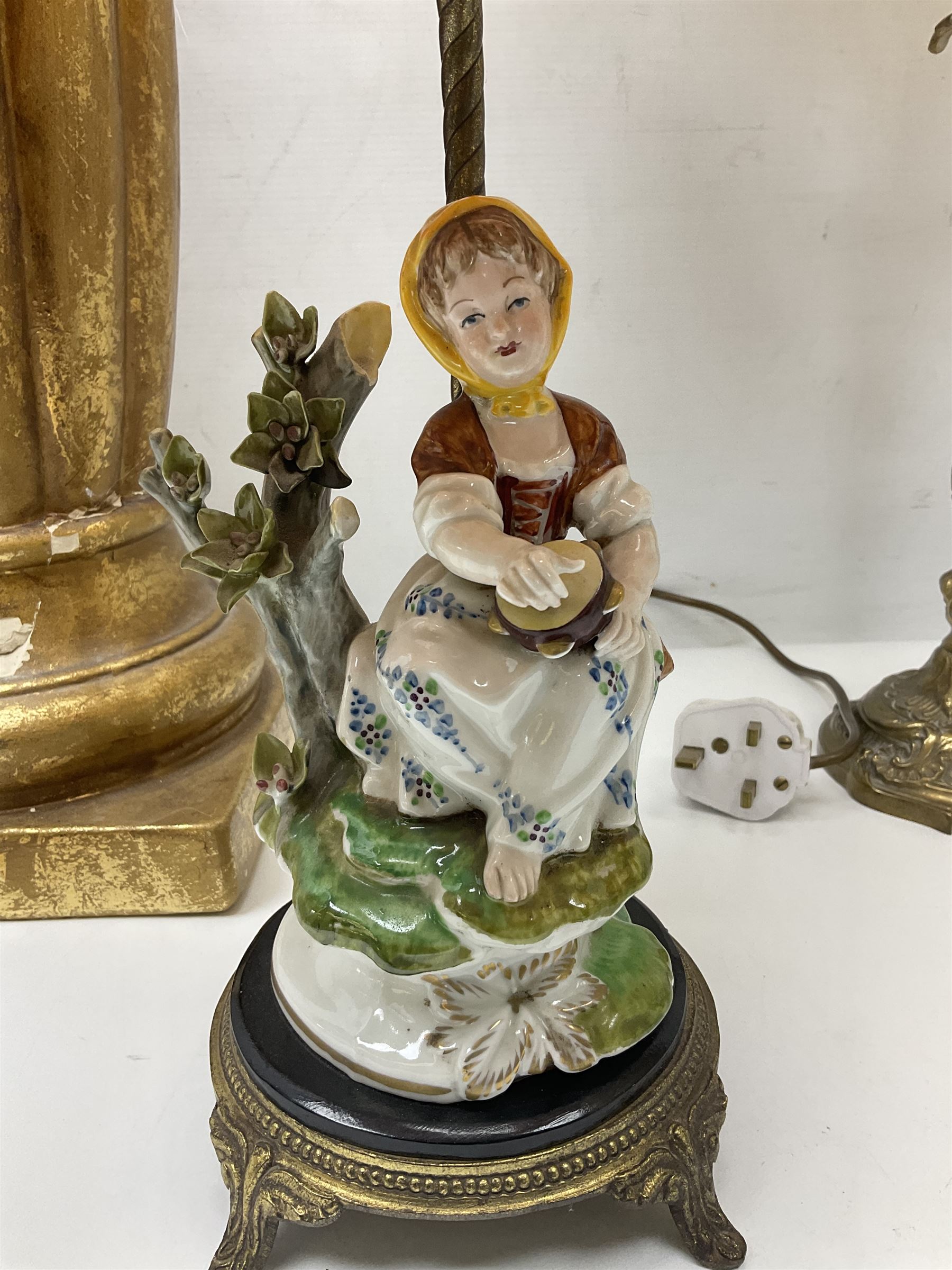 Green onyx and gilt metal table lamp decorated with puttos, together with gilt jardiniere stand and two other table lamps, stand H62cm