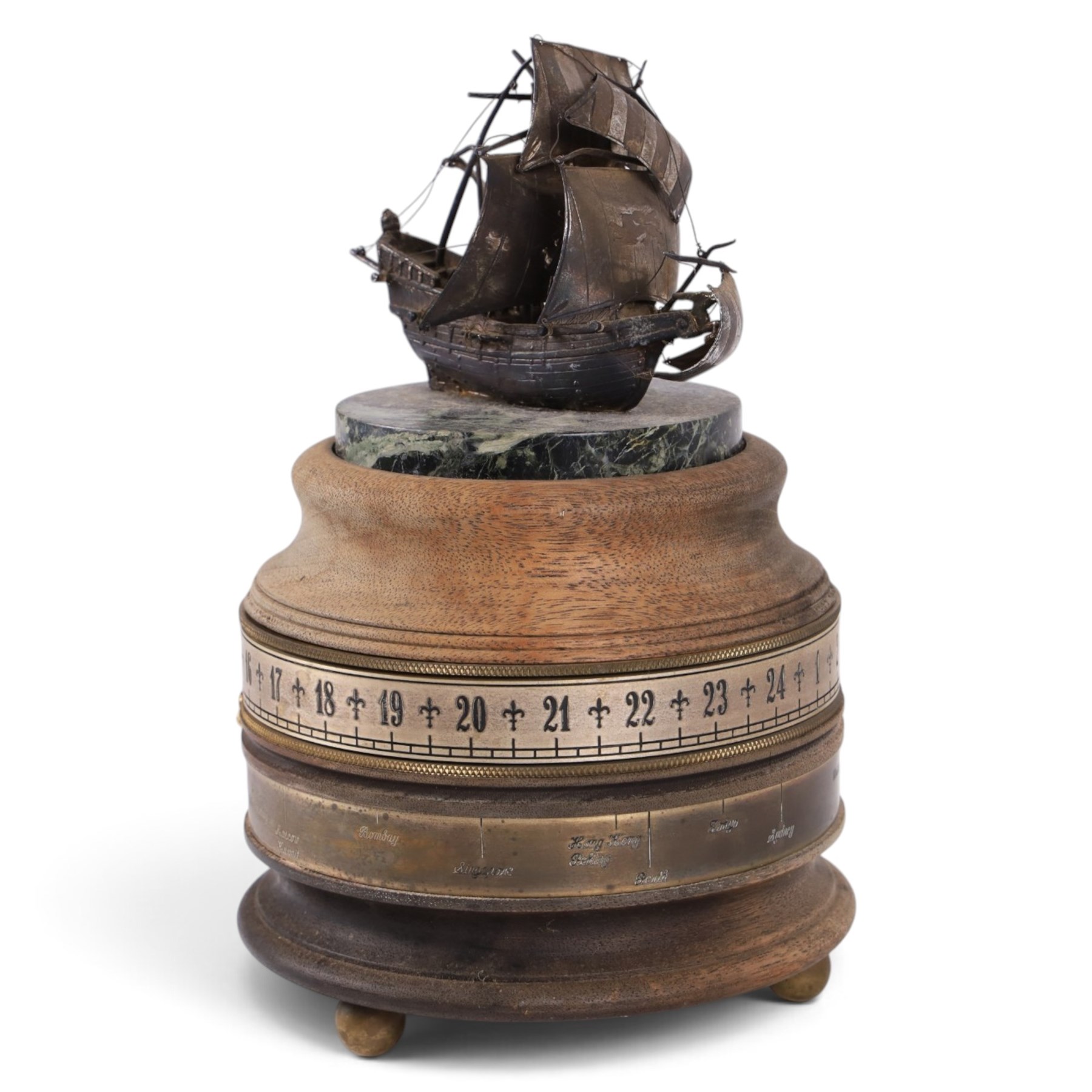 Limited edition Charles Frodsham of London for The St. James's House Company 'Mariners World Clock', the cylindrical brass and wooden body with two silvered annular chapter rings displaying the time and world location, surmounted by silver model of the Golden Hinde upon marble plinth, no. 240/500, H24cm 