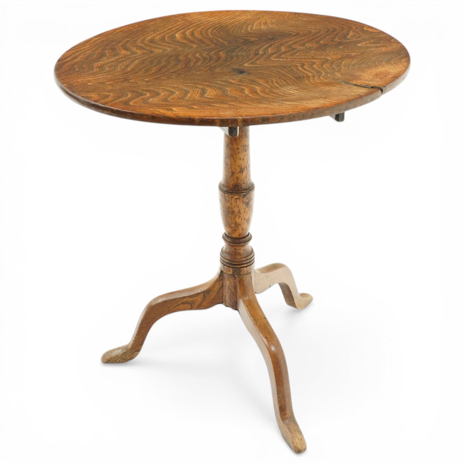 George III figured elm wine table with oval flip-top, raised on turned vasiform pedestal with tripod base