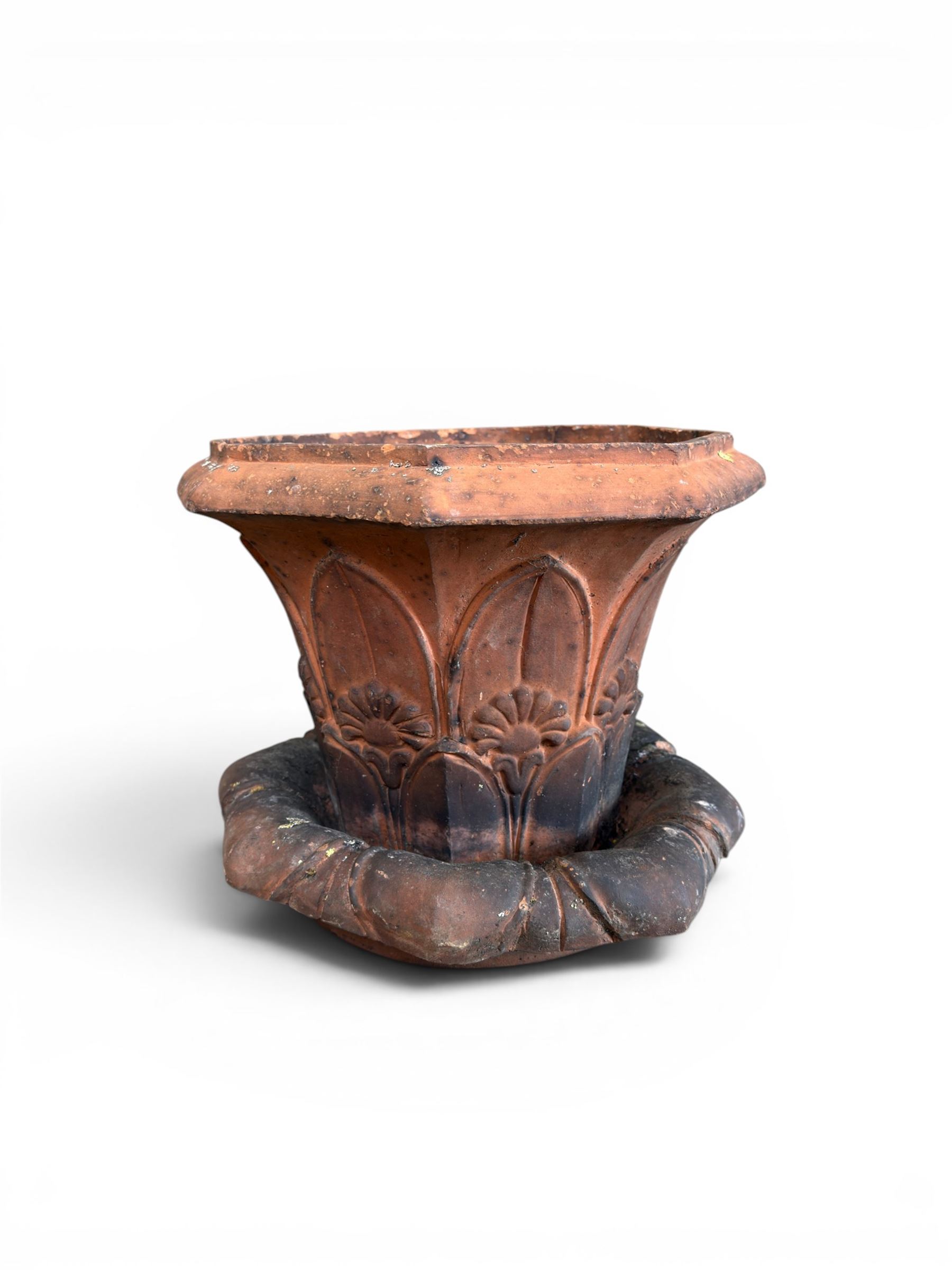 Small 19th century terracotta octagonal planter with stand, flower and leaf design