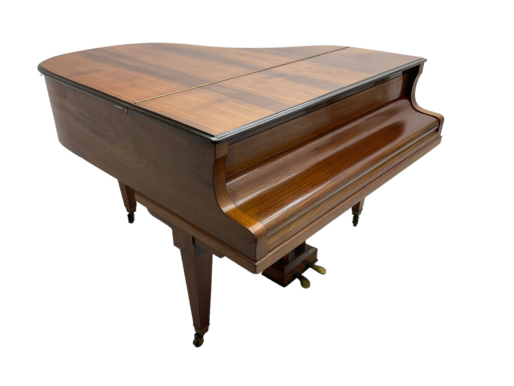  Antonin Petrof - Walnut overstrung baby grand piano, 7 0catve 85 key compass with original strings, tuning pins, damper felts and hammer heads, with roller keyboard action and iron frame, sustaining and una-corda pedals, sliding open lattice music desk, supported on square tapering legs with brass cups and castors, with inner ebonised key fall and ivorine label inscribed 'Supplied by Harrods, London'.