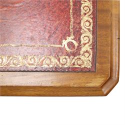 Late Victorian mahogany desk with red leather top, rectangular top with inset toold red leather writing surface, central long frieze drawer flanked by two short drawers, above pedestal with three graduating drawers with ring pull handles, on moulded plinth bases raised on castors