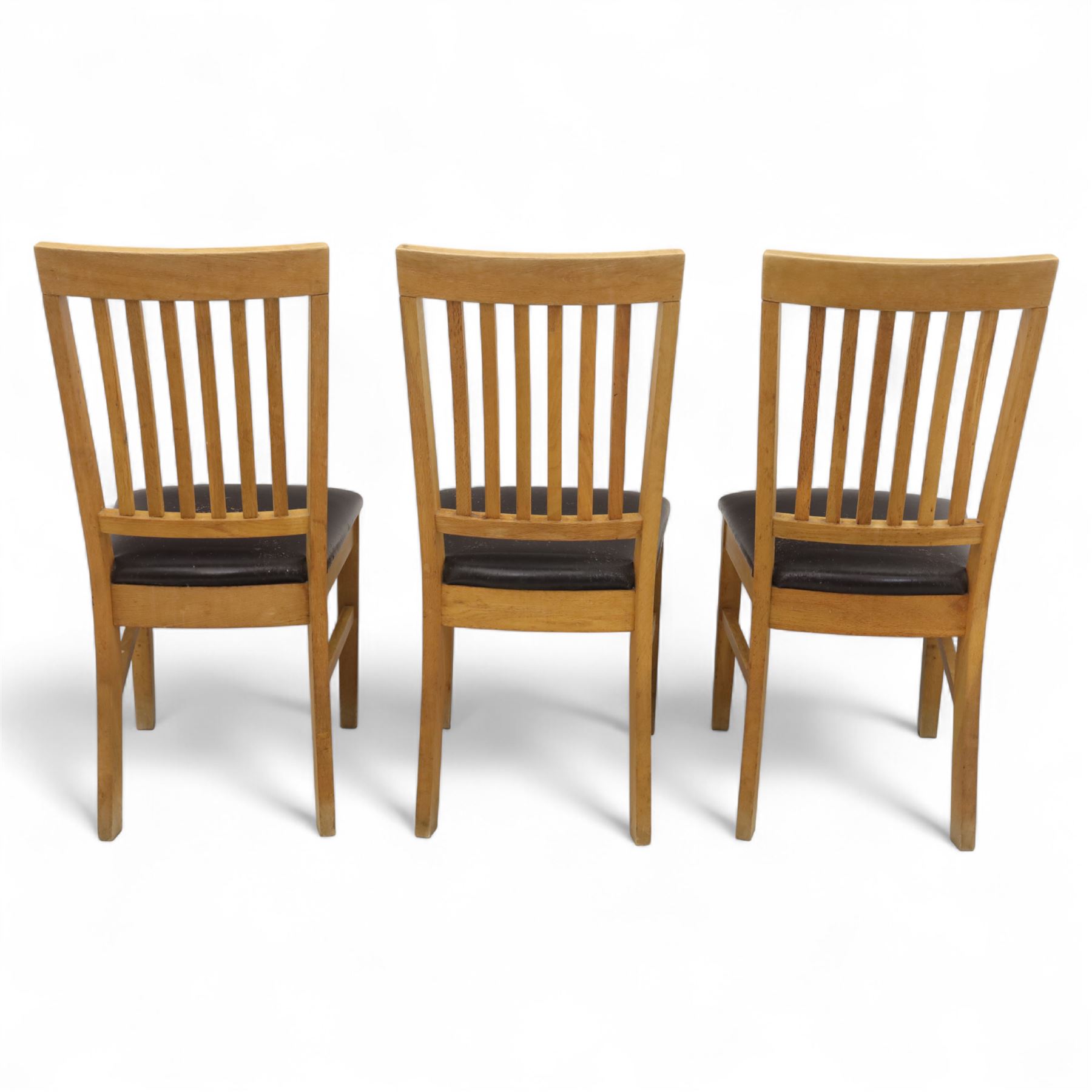 Contemporary set of six light oak dining chairs with faux leather cushion seats 