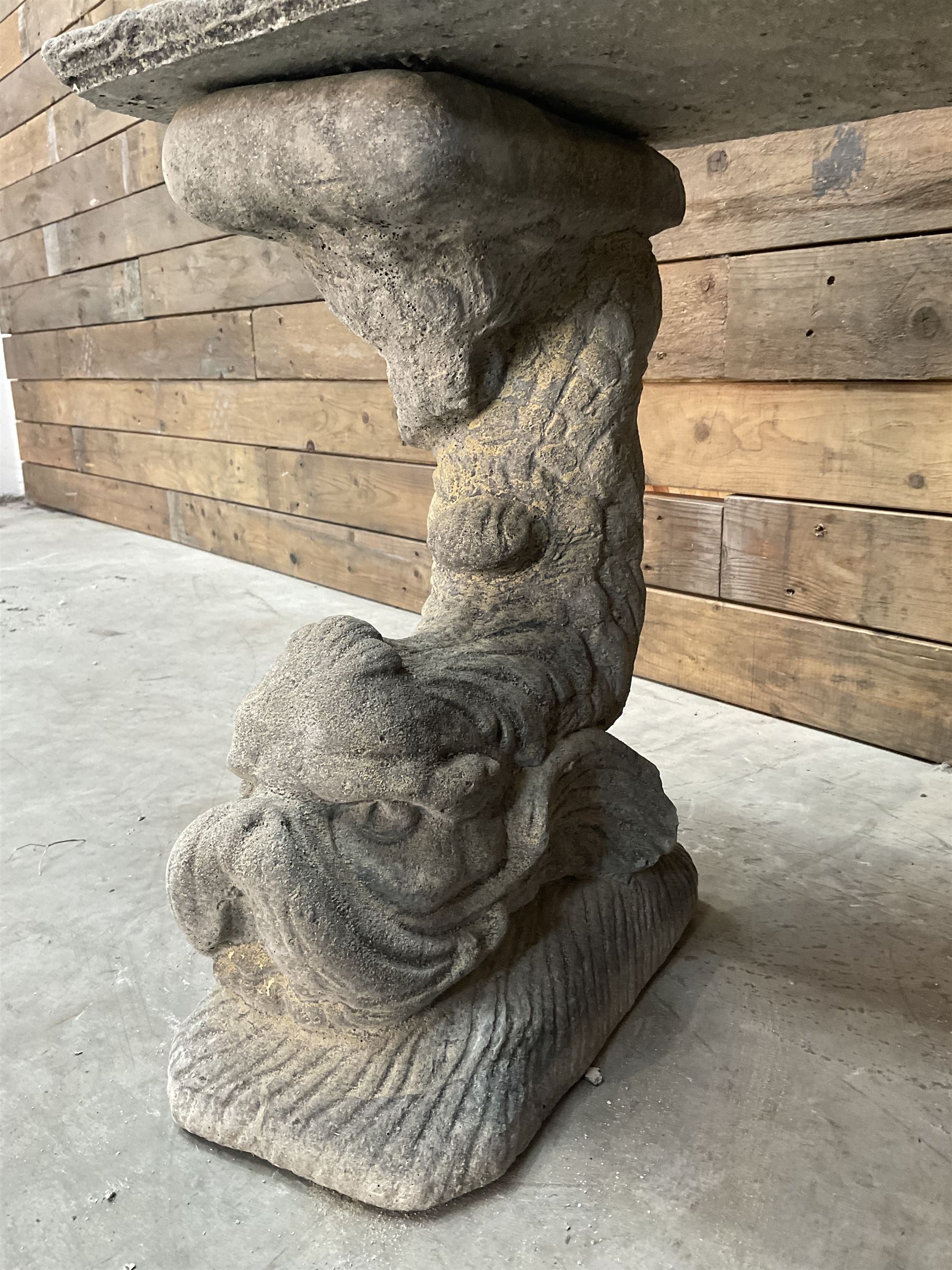 Cast stone four piece curved Dolphin bench, set with three dolphin pillars, curved rectangular slab top with detailed border