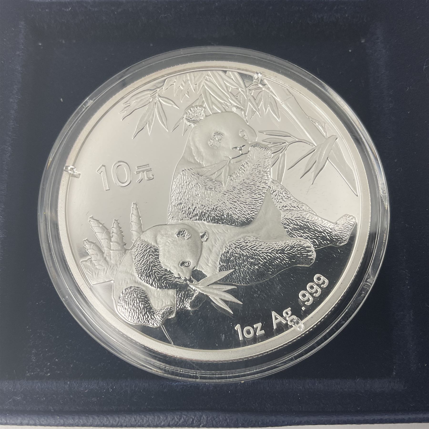 Four one ounce fine silver coins, forming 'The 2007 Famous World Silver Coin Collection', comprising United States eagle, Australian kookaburra, Chinese panda and Canadian maple leaf, cased with Westminster certificate 