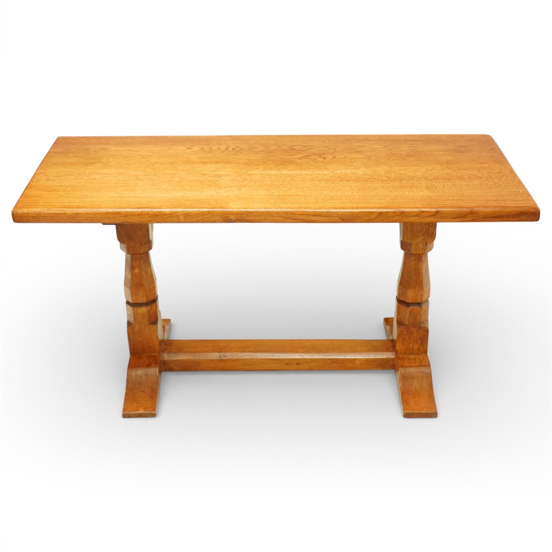 Sid Pollard of Thirsk - Yorkshire oak coffee table, rectangular adzed top with softly moulded edge, raised on twin octagonal baluster supports, united by a plain stretcher, on shaped splayed feet