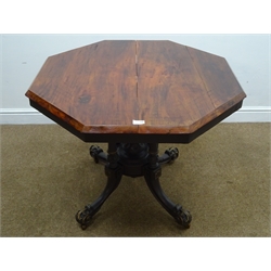  Victorian mahogany octagonal table, four turned column joined by central finial on four sabre supports with acanthus scroll feet on castors, W95cm, H72cm  