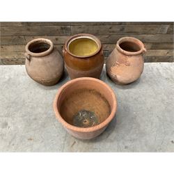 Pair of terracotta water jugs, H46cm, glazed pancheon and a circular planter (4)