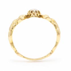 Gold diamond figural ring, single old cut diamond of approx 0.45 carat, with a nude female figure either side, stamped 18ct