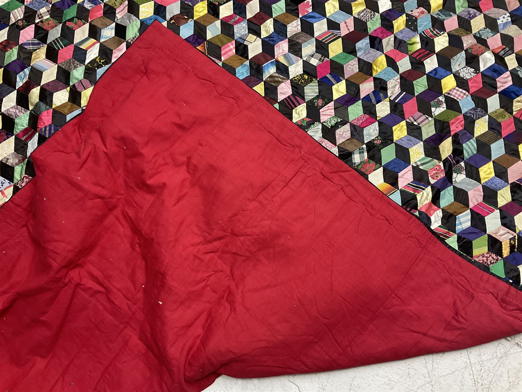 19th Century silk and satin tumbling blocks pattern patchwork quilt with black border 228cm X 196cm