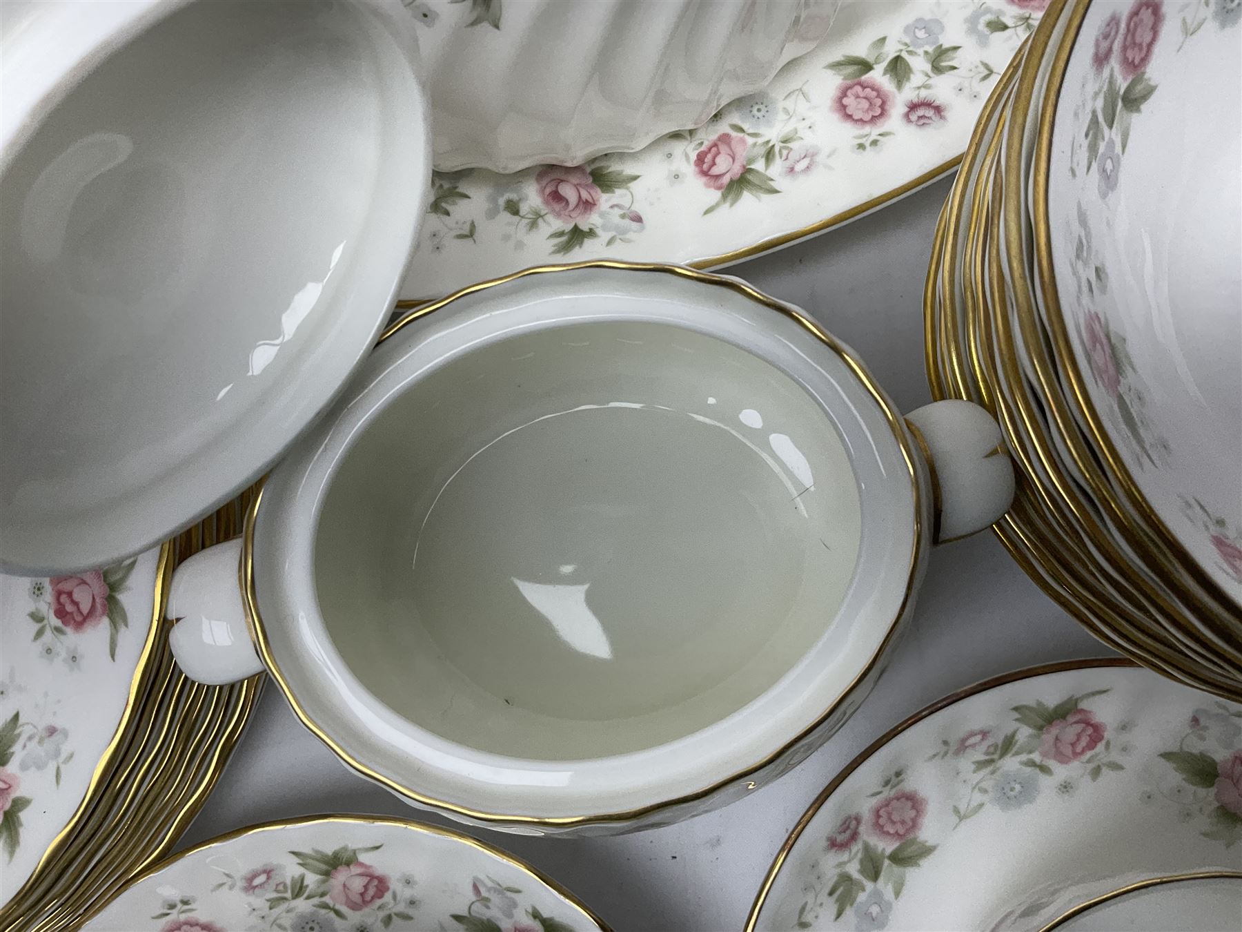 Minton Spring Bouquet pattern dinner and tea service, comprising dinner plates, twin handled tureens with covers, meat platter, teapot, milk jug, sugar bowl with cover, tea cups and saucers, bowls, cake plate, side plates, dessert plates, etc all with printed mark beneath (82)