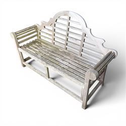 Lutyens design teak garden bench, shaped arched and slatted back over rolled arms and slatted seat, raised on square supports with box-stretcher