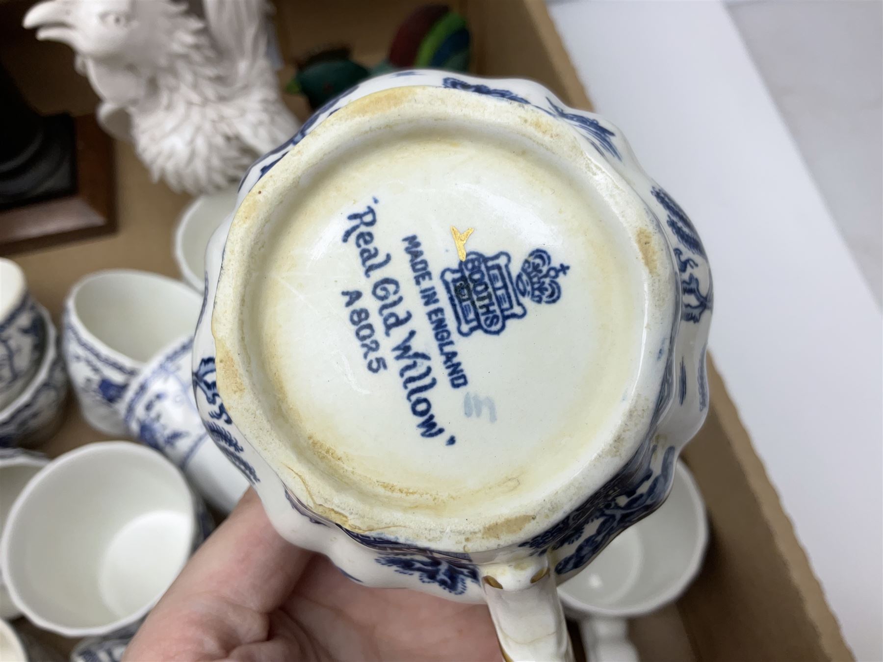 Johnson Bros Indies pattern tea and dinner wares, painted metal female bust on wooden plinth, three radios including one Roberts, Zenit B camera body, Polaroid 1000 land camera, Lorus wristwatch, and other ceramics etc, in four boxes