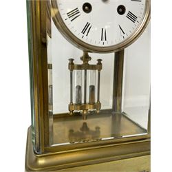 French late 19th-century 8-day four-glass clock, in a cornice style case with bevelled glass panels, white enamel dial with roman numerals and minute markers, steel arrow-hands with a Parisian rack striking movement, striking the hours and half-hours on a bell, twin file mercury pendulum.