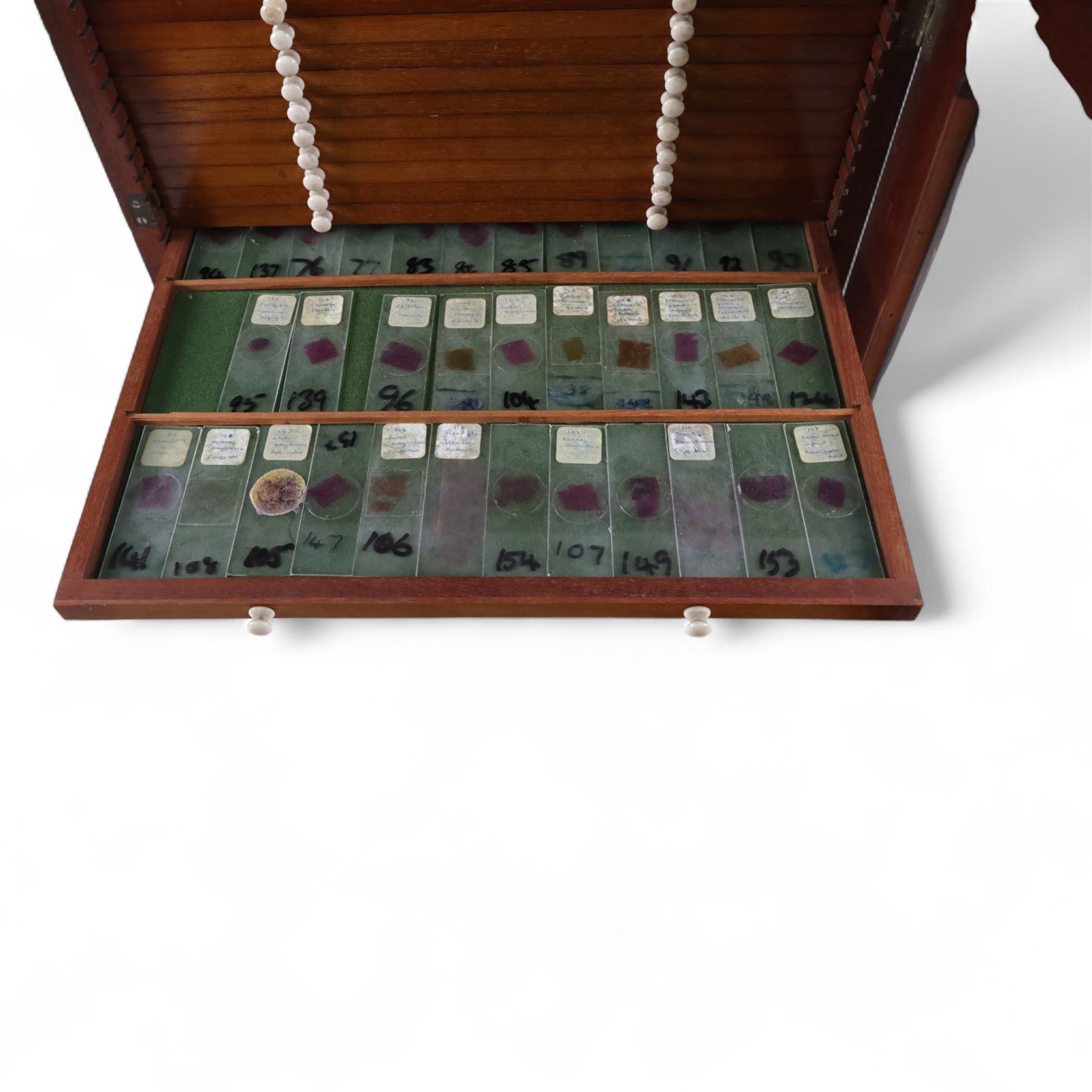 Victorian collector's specimen cabinet, containing a number of prepared microscope slides including miniature photographs, animal and human pathological, physiological and histological specimens and botanical specimens, mostly annotated in ink, the cabinet with glazed door, the drawers with bone handles and lined with green felt, owned by Dr Arthur Bristow, together with a picture of the doctor, cabinet H43cm