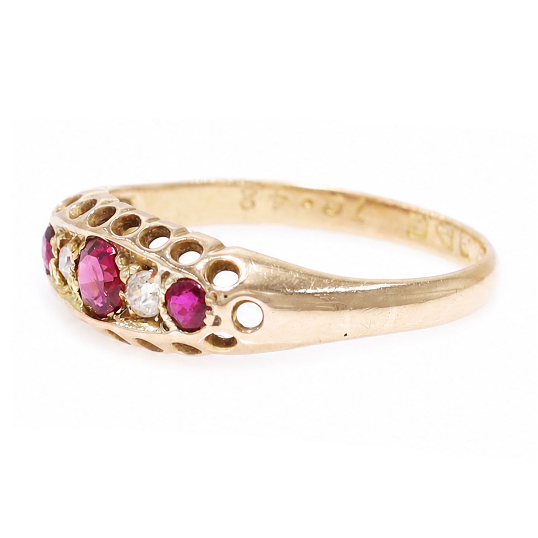 Early 20th century 18ct gold ruby and diamond ring, three round cut rubies, spaced by two old cut diamonds, Chester 1914, 