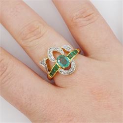 Gold emerald and diamond ring, the principal oval cut emerald, with three calibre cut emeralds set either side, within a diamond set fancy openwork setting