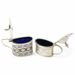 Silver three piece oval condiment set with engraved decoration Birmingham 1961, pierced silver mustard pot Chester 1901, silver pepperette and silver mounted glass salt