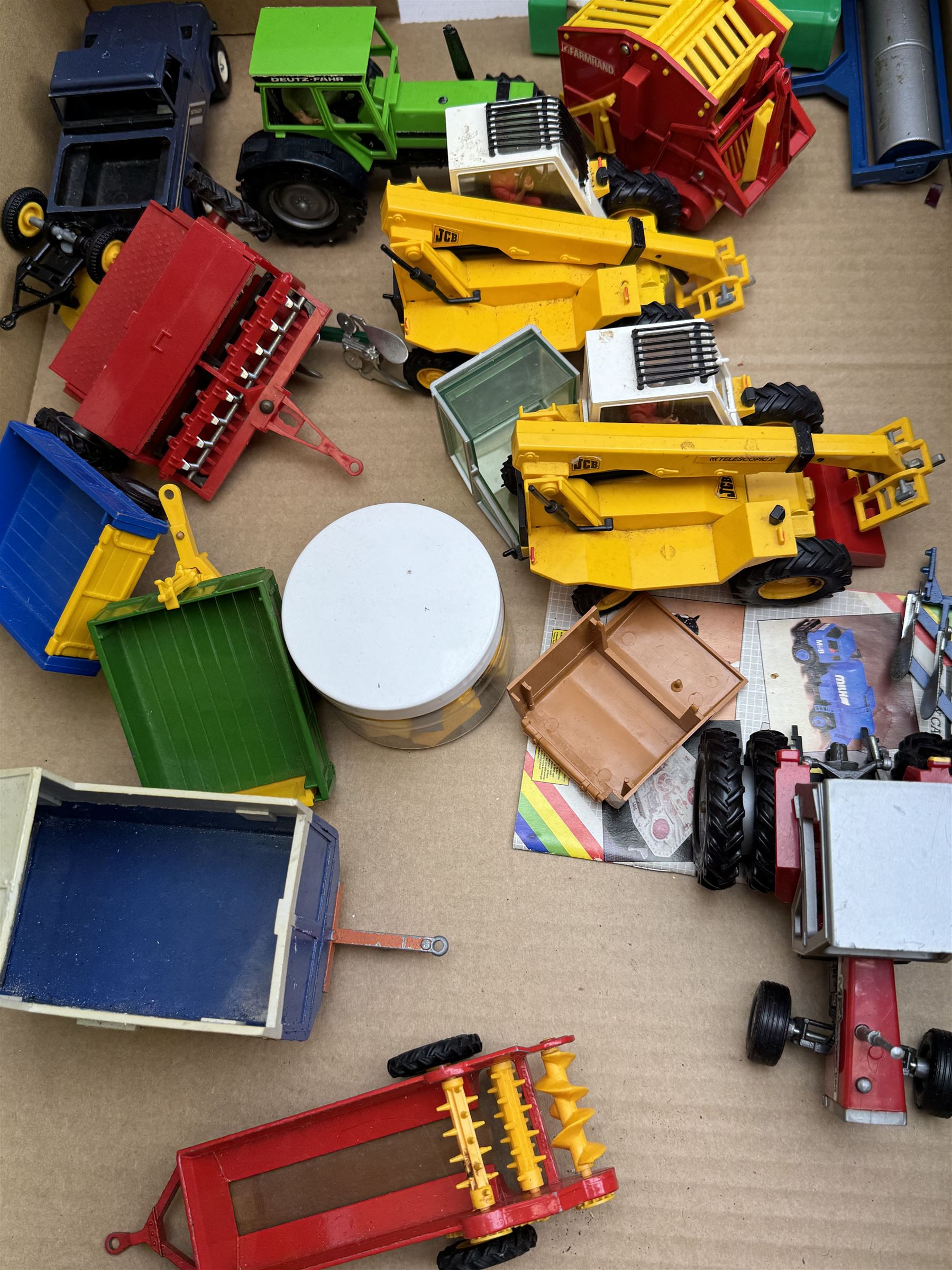 Collection of predominantly late 1970s/early 1980s Britains diecast vehicles and farming equipment, including Corn King, tractors, JCBs, horsebox, skip lorry, etc together with figures and accessories
