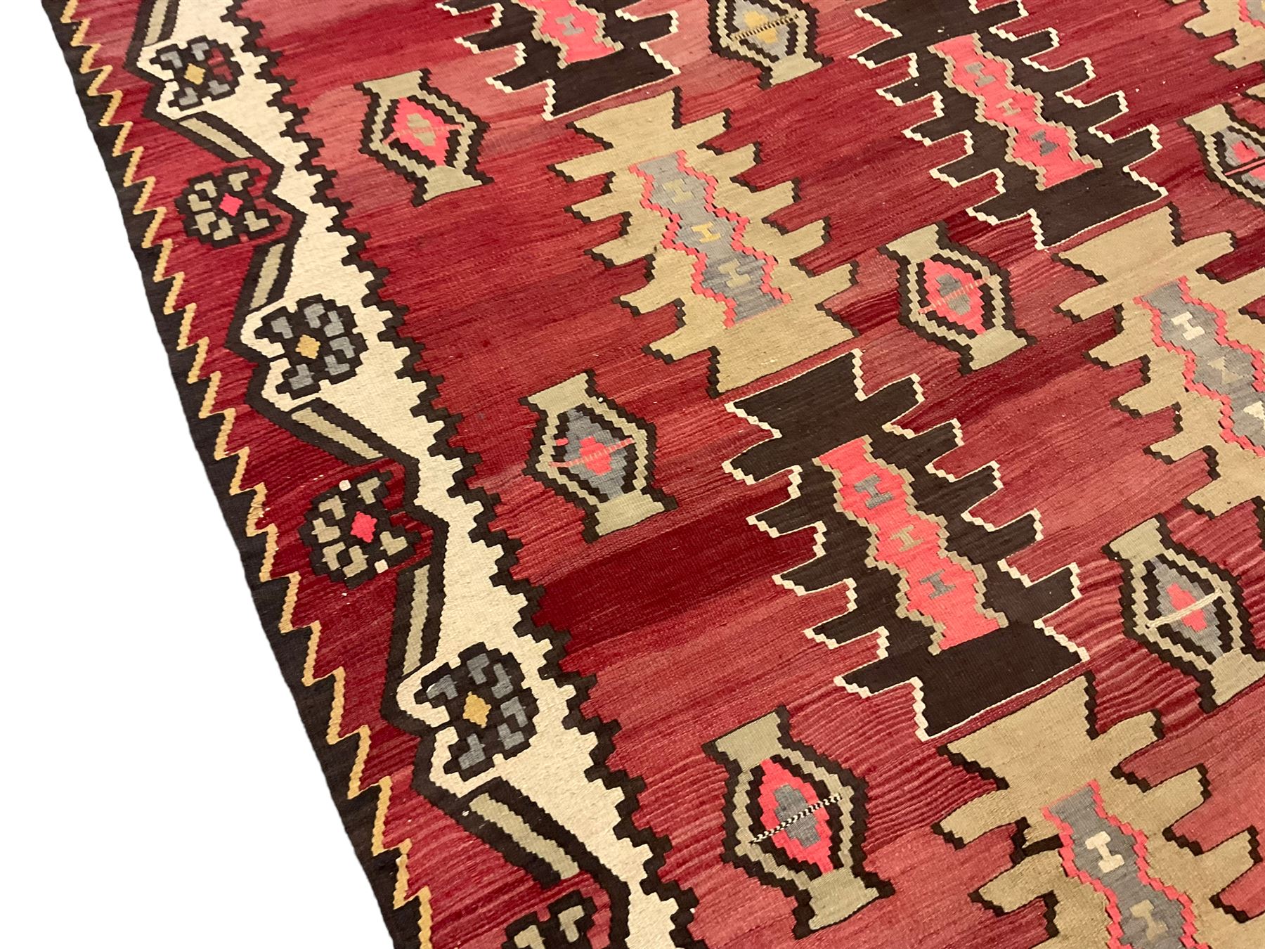 Large  red ground Kilim rug or wall hanging, decorated with geometric patterns and dated within the weave '1969'