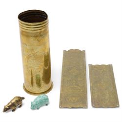 First World War trench art shell casing, decorated with crest for The Kings Own Royal Lancaster Regiment, one side decorated with detailed portrait; together with Two Victorian Brass finger plates together with a brass badger and a saussurite model of a pig