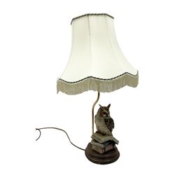 Moulded resin table lamp modelled as an owl perched upon a stack of books with cream tasselled lamp shade, H60cm