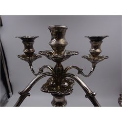 Modern silver five branch candelabra centrepiece, the four extending branches each with removable sconces, surrounding a central candle holder, upon a knopped stem and weighted stepped square foot, with anthemion to each corner, hallmarked Roberts & Belk, Sheffield 1984, H36cm 