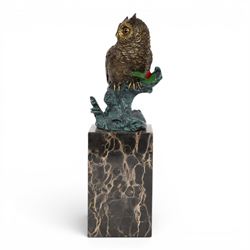 Cold painted bronze figure, modelled as an owl perched upon a tree stump signed Milo and with foundry mark, raised upon black veined marble plinth, H27.5cm
