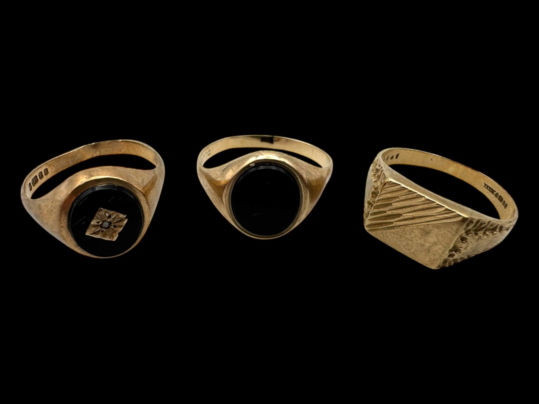 Three 9ct gold signet rings, including two onyx examples, all hallmarked 