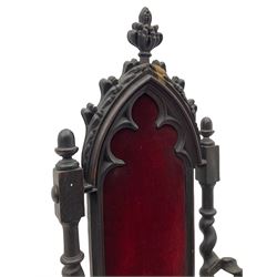 Victorian oak and wrought metal Gothic open armchair, the pointed arched back carved with foliate, cusped inner arch upholstered in red, spiral turned uprights and supports, with arms made of spiral forged metal