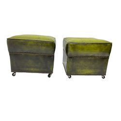 Pair pouffes, upholstered in green leatherette with studwork
