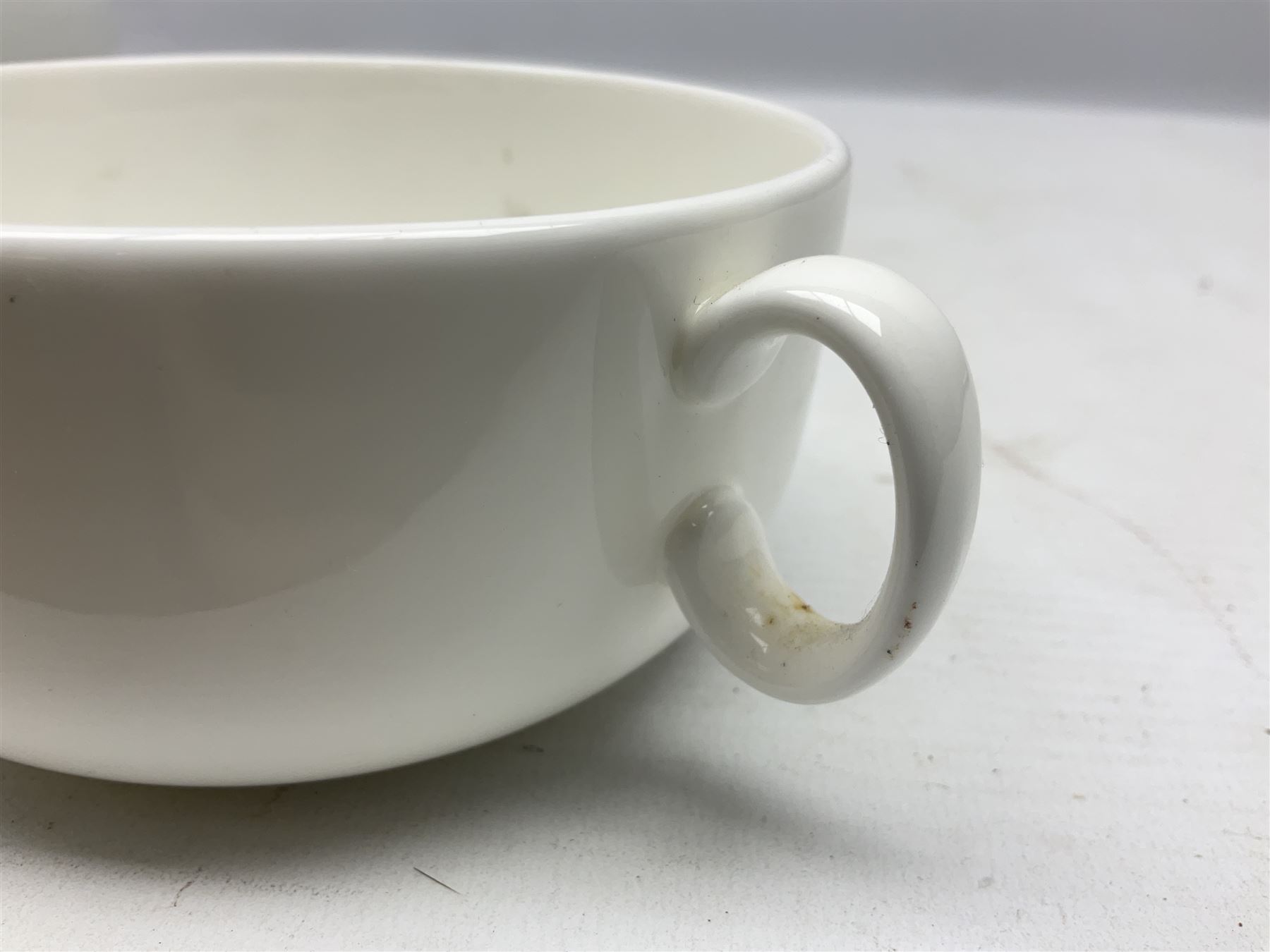 Thun WW2 German Luftwaffe officer's mess plain white glazed soup tureen with lion mask handles, marked with the Luftwaffe eagle beneath and dated 1939 L31cm; together with Waffen 'SS' white glazed twin handled soup bowl, marked beneath Bauscher Weiden 1942 (2)