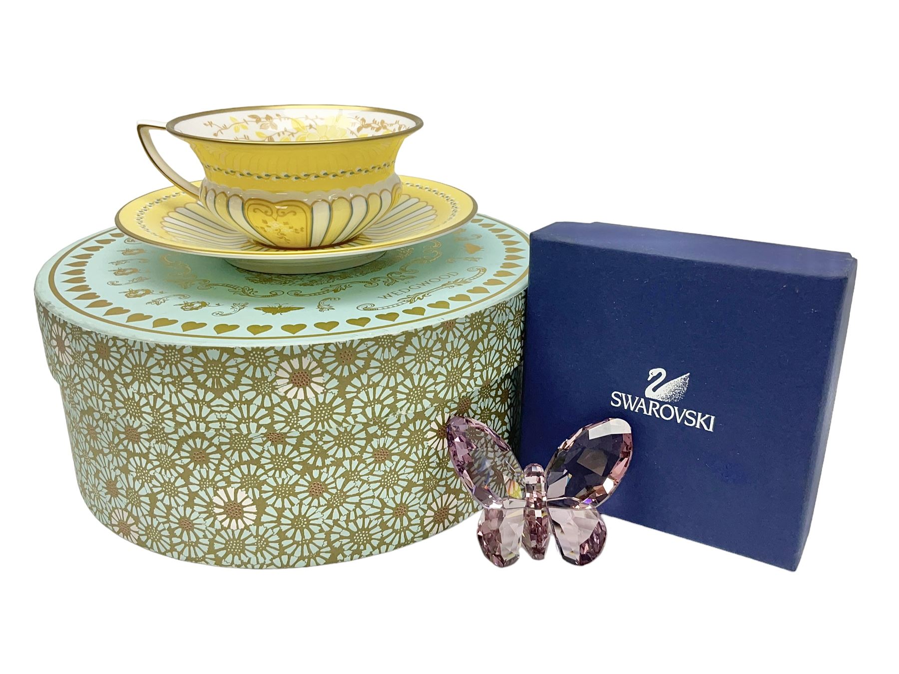 Wedgwood Yellow Ribbons cabinet cup and saucer, boxed and a Swarovski butterfly, boxed (2)
