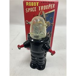 Three vintage battery operated robots comprising tin-plate Space Walk Man ME 100 Robot, Saturn the 13