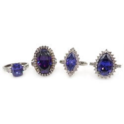  Four silver blue/purple stone and cubic zirconia dress rings, stamped 925  