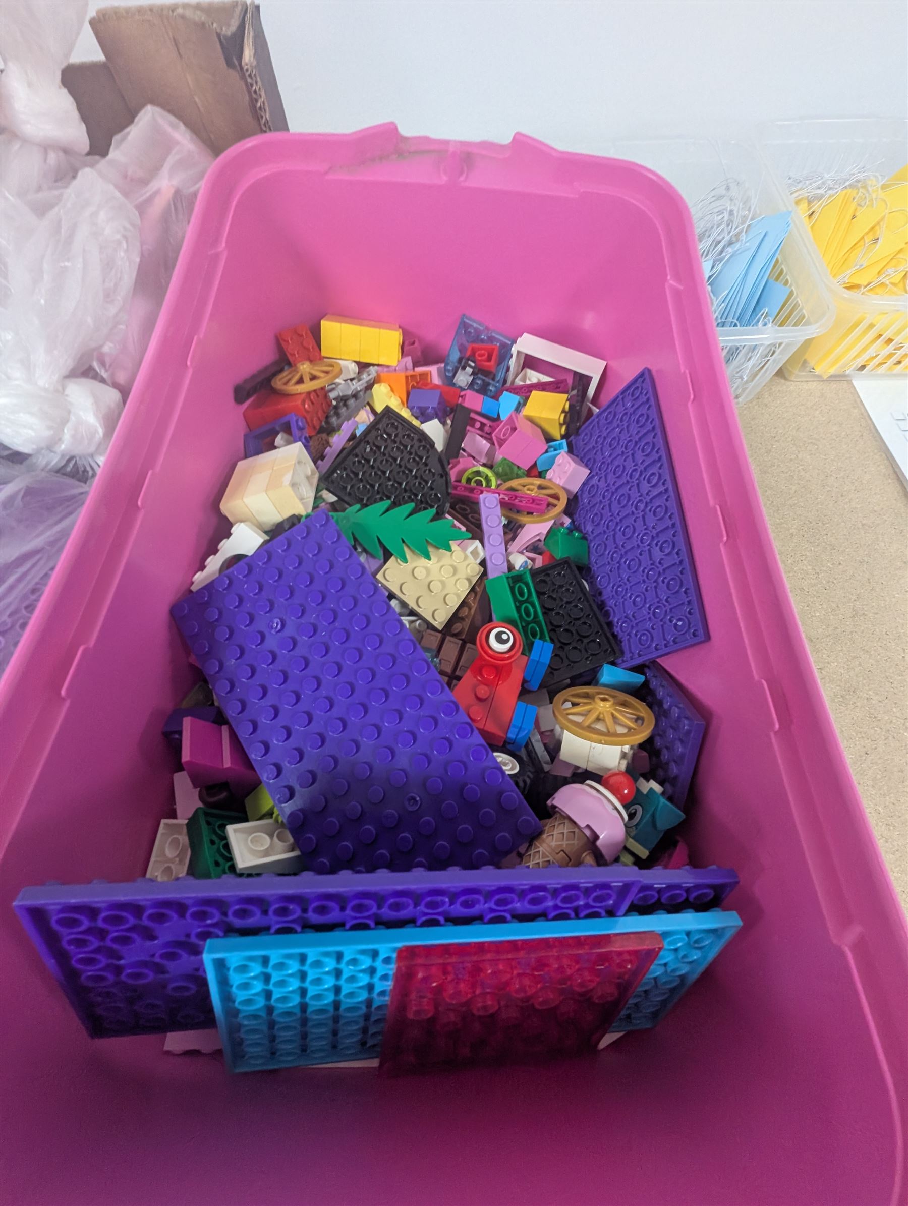 Lego Friends no. 3189 Stables set, Lego Trolls no. 41252 World Tour set, The Lego Movie set no. 70825, three small Lego Friends sets, all boxed and a quantity of loose Lego, including purple and pink colourways