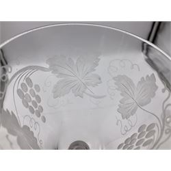 Set of three 18th century style wine glasses, each with funnel bowl etched with fruit vine, upon a double series air twist stem and circular foot, H17cm