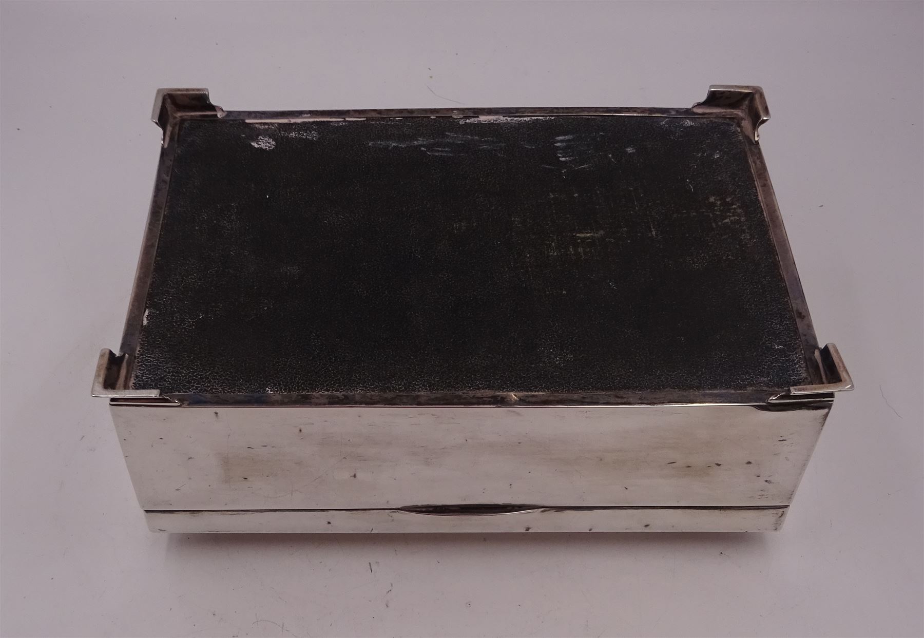 1920s silver mounted presentation cigarette box, of rectangular form, with engraved initials J.W.J and dated 1902-1927 to slightly domed hinged cover, opening to reveal compartmentalised softwood interior, upon four bracket feet, hallmarked Birmingham 1920, maker's mark worn and indistinct, H9cm, W23cm, reputedly given to John William Johnson, father of Amy Johnson,  famous for being the first long distance (to Australia) solo female pilot, and first female British grounds engineer, for his silver wedding anniversary