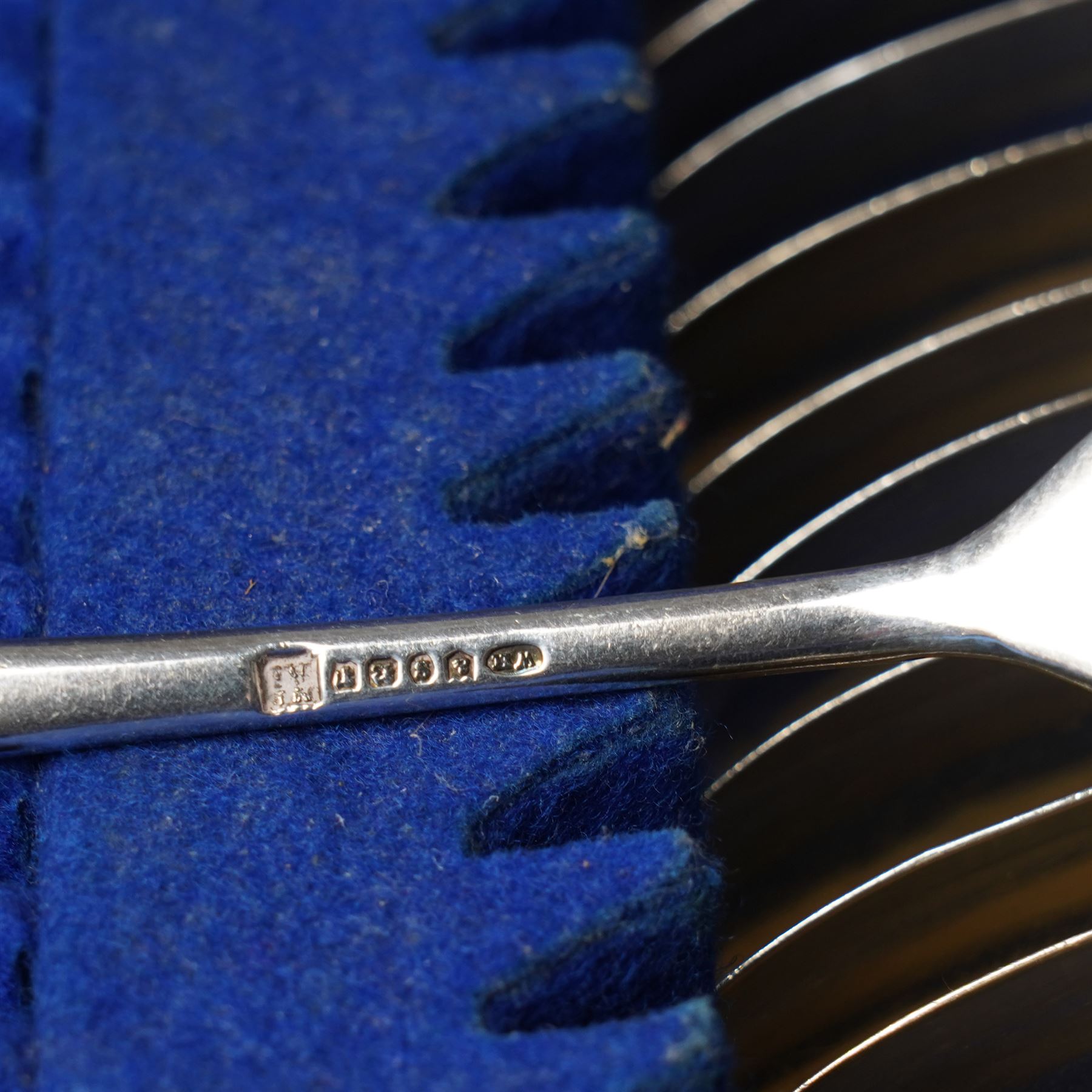  Canteen of silver cutlery comprising twelve dessert spoons, twelve dessert forks, twelve teaspoons, four table spoons and four table forks in oak case London 1938 Maker Josiah Williams & Co