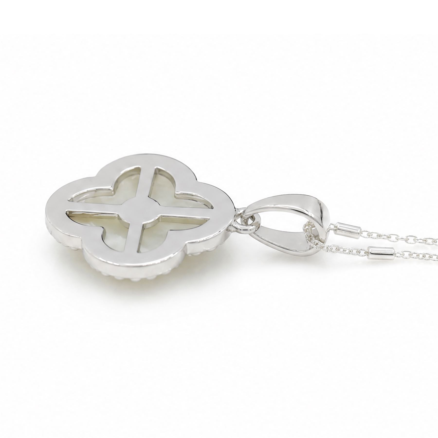 Silver cubic zirconia and mother of pearl flower head pendant necklace, stamped 925