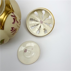 A Royal Worcester blush ivory potpourri jar and cover, with inner cover, of lobed ovoid form decorated with flowers and heightened with gilt, with puce printed mark beneath, Rd no 112588, 1313, H20cm. 