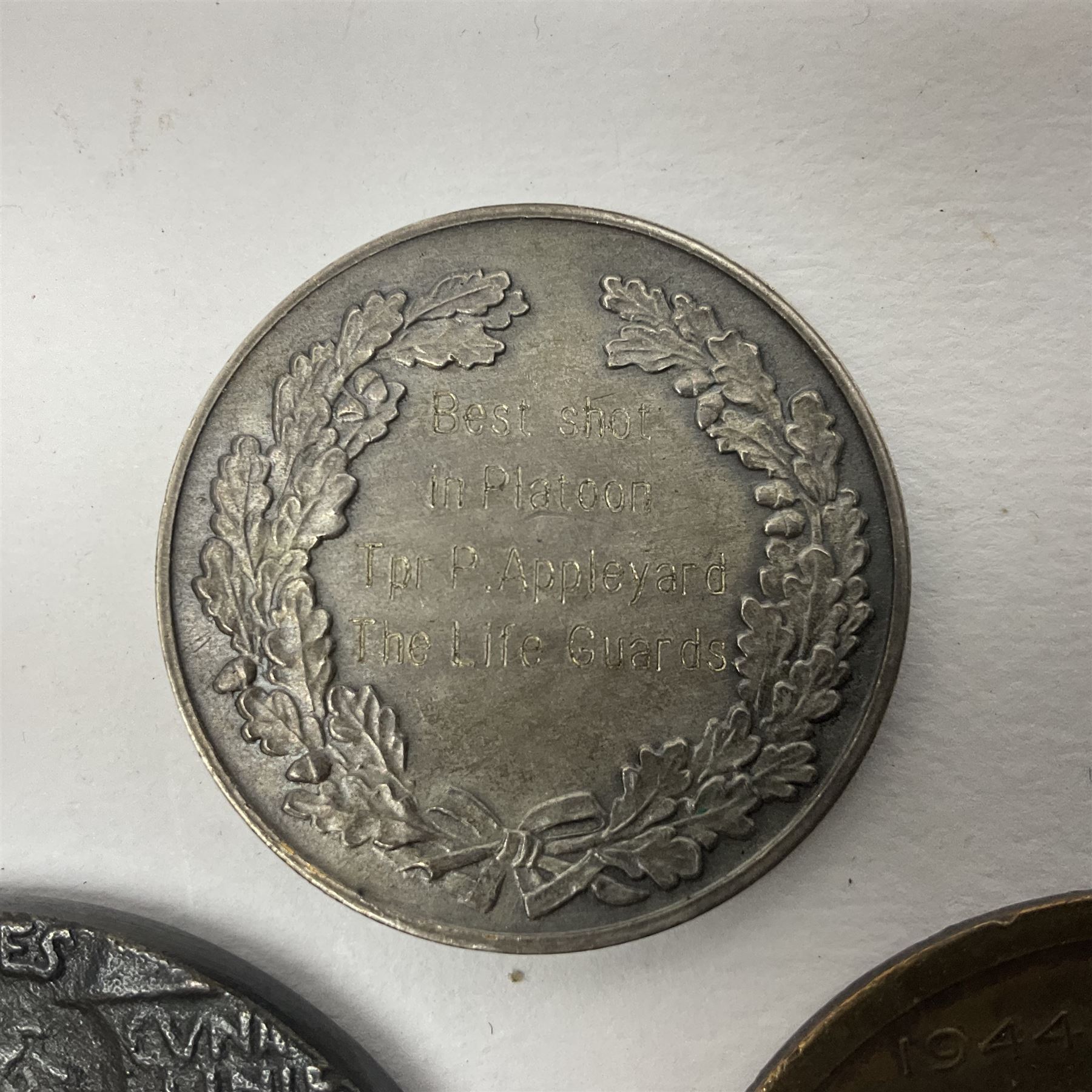 RMS Lusitania iron medallion dated 5th May, 5.5cm diameter, boxed with St Dunstan's Blinded Soldiers Profit paperwork; another unboxed similar Lusitania medallion; 30th Corps Alamein Cuxhaven medallion; Battle of Jutland 1916 silver memorial pendant; Navajo Code Talkers medallion 2000; and five other military related medallions