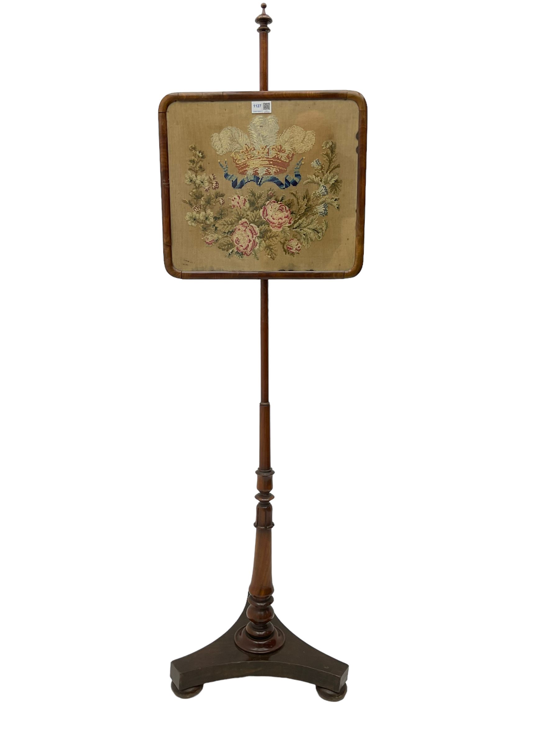Victorian mahogany pole screen, with needlework panel depicting the Prince of Wales feathers and floral garland, vasiform pole with lappet decoration, on a concaved triangular platform with compressed bun feet