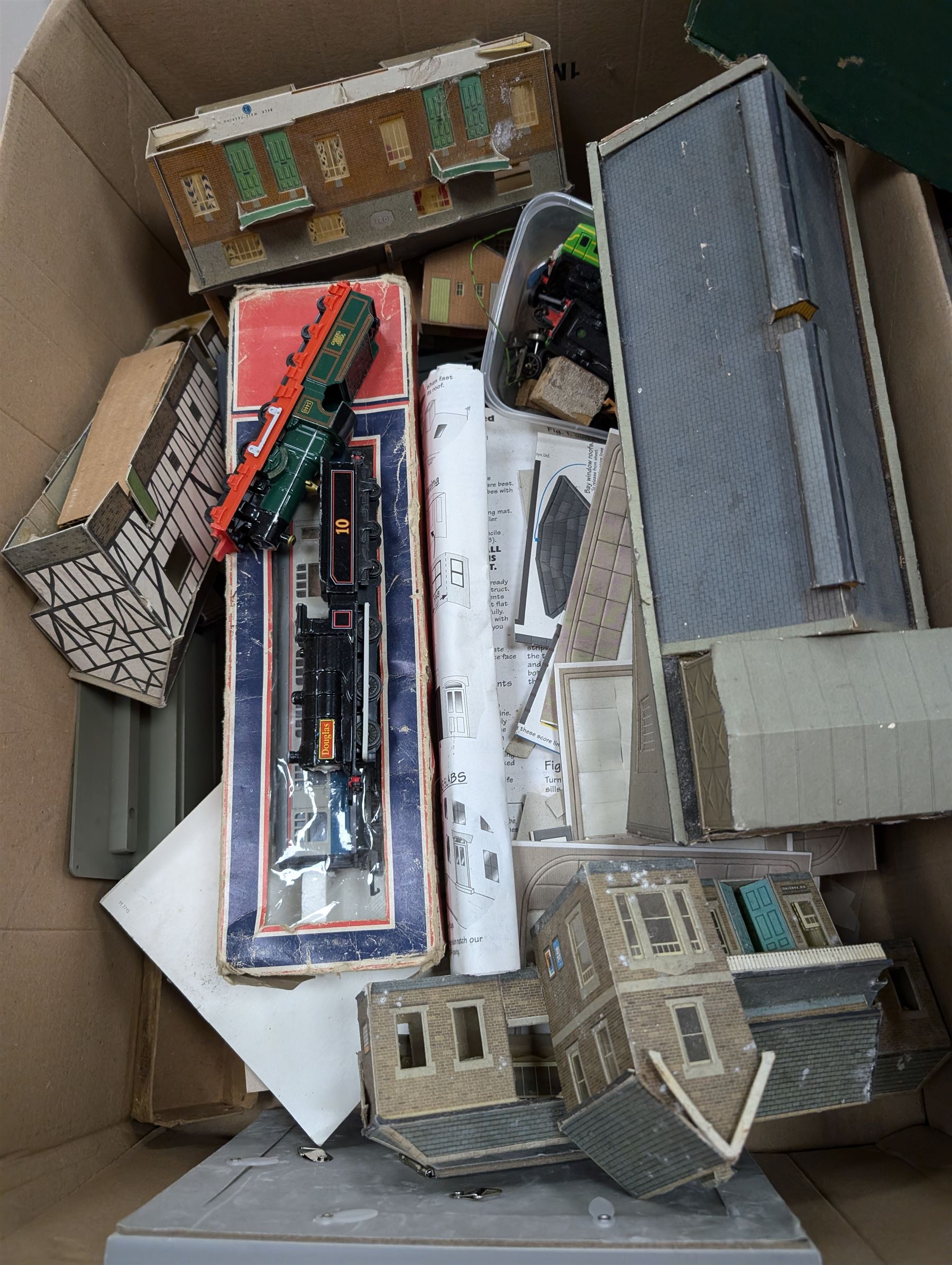 Collection of model railway buildings and other accessories, together with a box empty Hornby boxes, including three trainset boxes with pieces of track inside only
