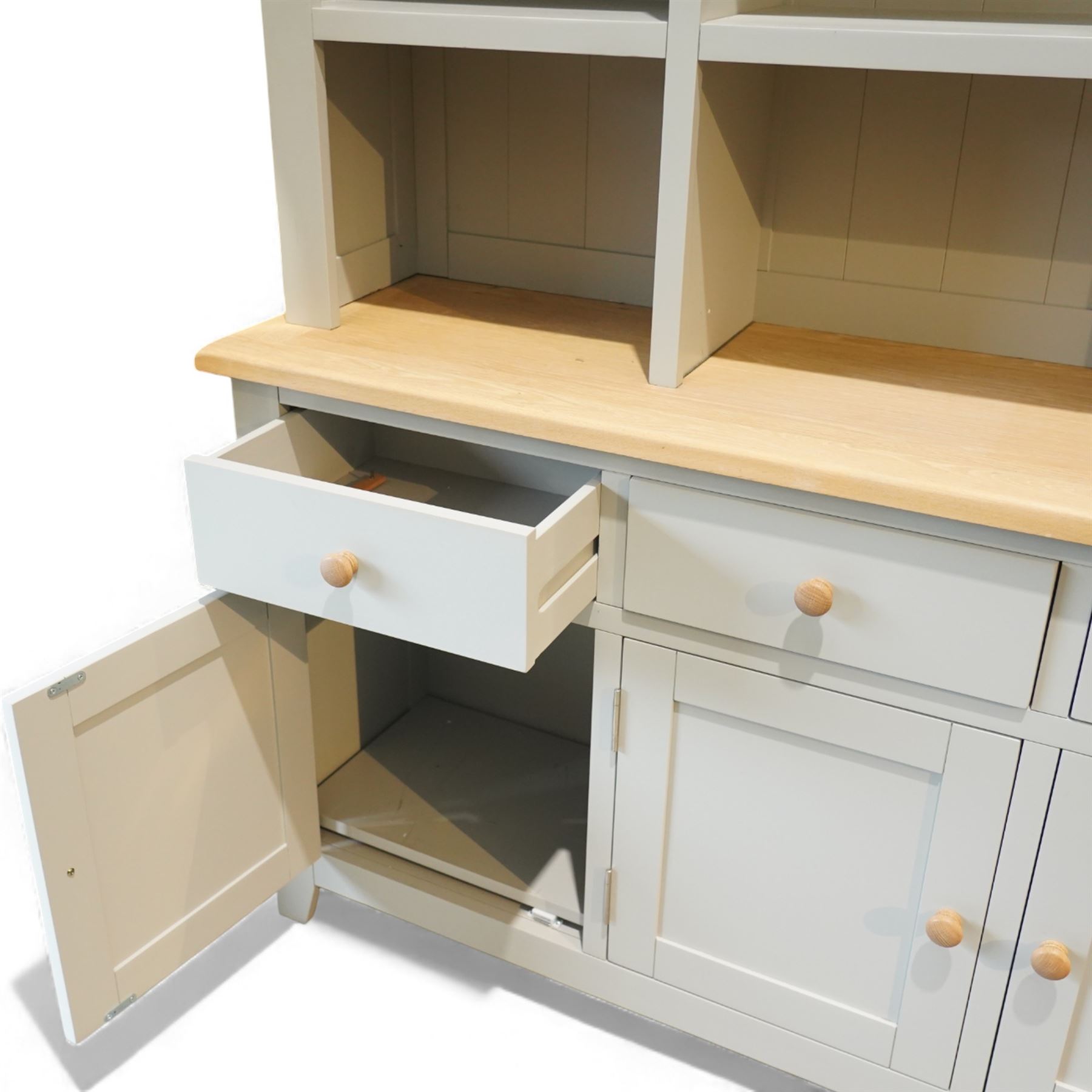Cotswold Company - 'Chester' dresser painted dove grey with contrasting oak top, the upper rack divided into nine open shelves with panelled back, the lower section fitted with four drawers and cupboard doors enclosing storage compartments