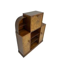 Early to mid 20th century Art Deco style walnut arch top writing cabinet, fall front enclosing fitted interior, two cupboards and shelving, on plinth base