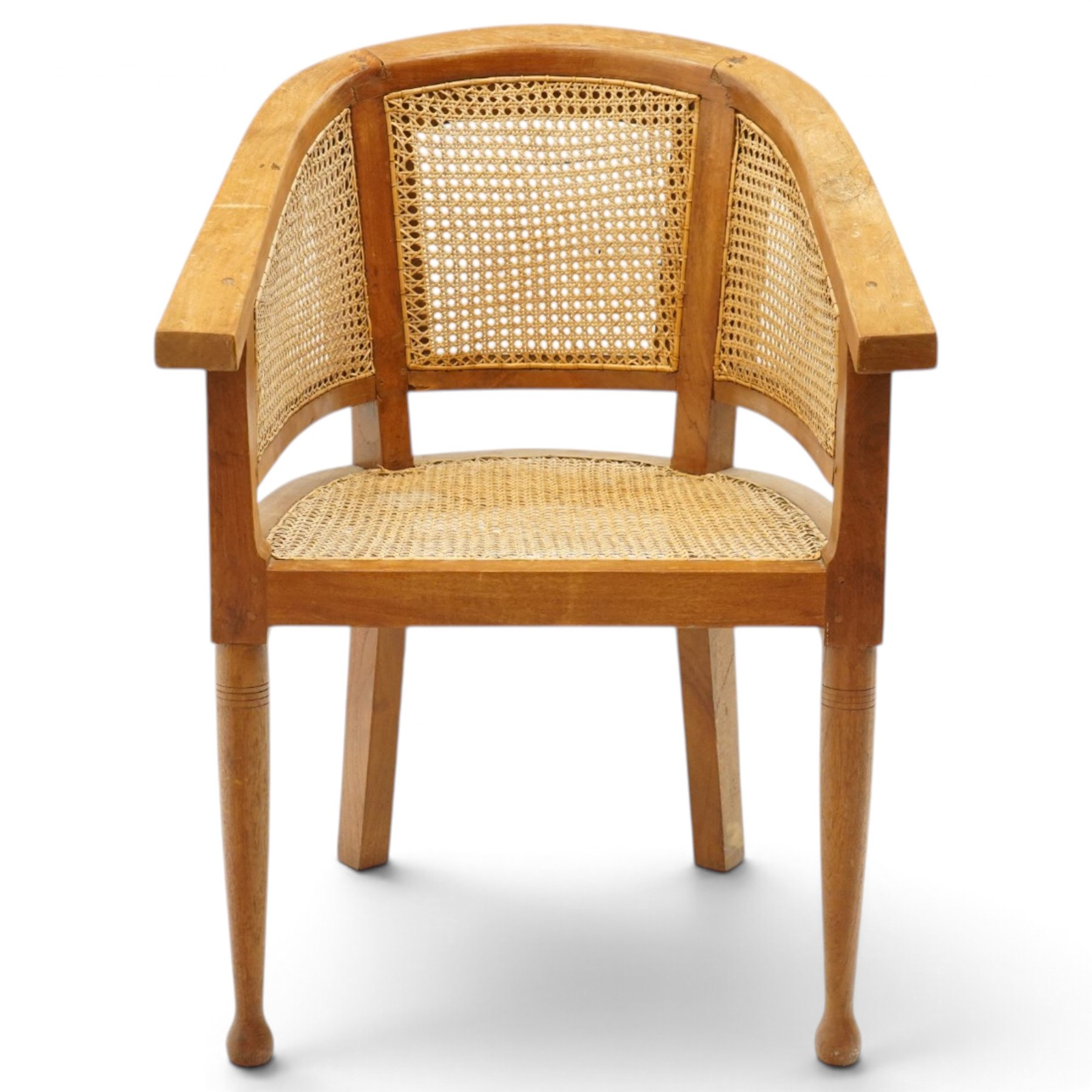Late 20th century Anglo-Indian teak framed bergère armchair with canework back and seat, raised on tapering supports
Provenance: purchased Liberty & Co in the 1990s from the oriental line